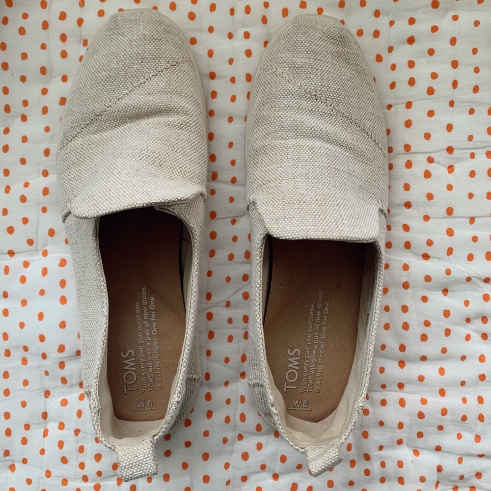 Women’s shoes. Slide-on TOMS. Cream colored